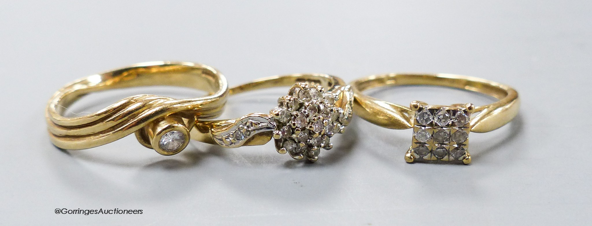 Three assorted modern diamond set dress rings, two stamped 9ct gold and one stamped 375, gross weight 6 grams.